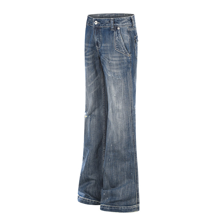 Side view of blue distressed flare jeans with wide legs and faded wash