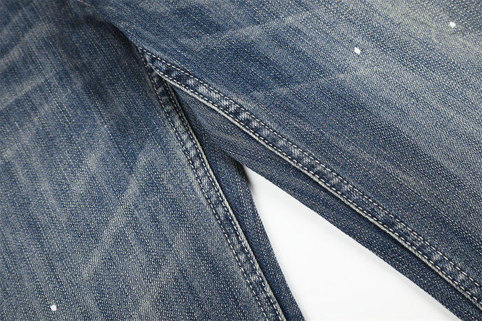Close-up of the leg seam on blue faded wide leg jeans