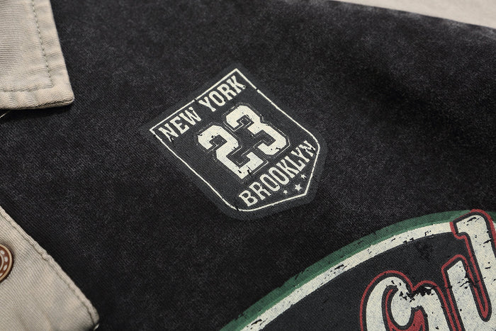 Close-up of New York Brooklyn patch on black rugby polo sweatshirt