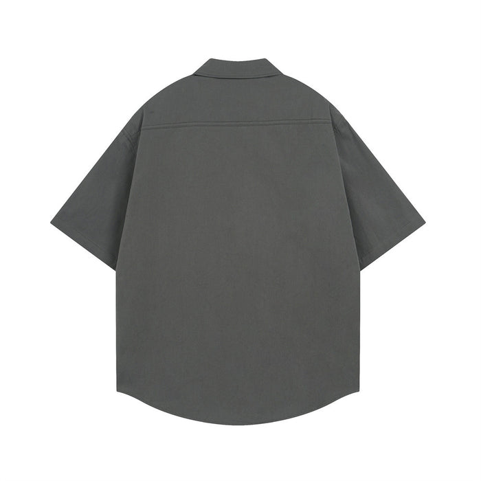 Charcoal oversized short sleeve button-down shirt shown from the back