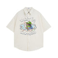 Cream oversized short sleeve button-down shirt with cartoon front graphic