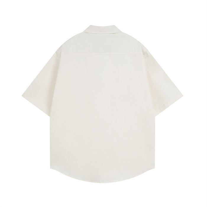 Cream oversized short sleeve button-down shirt shown from the back