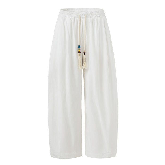 Men's baggy wide-leg pants in white with beaded drawstring and elastic waistband, relaxed street style fit