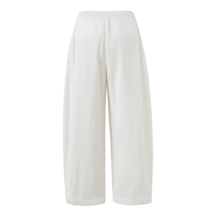 Back view of white wide-leg pants showing an elastic waistband and two rear pockets