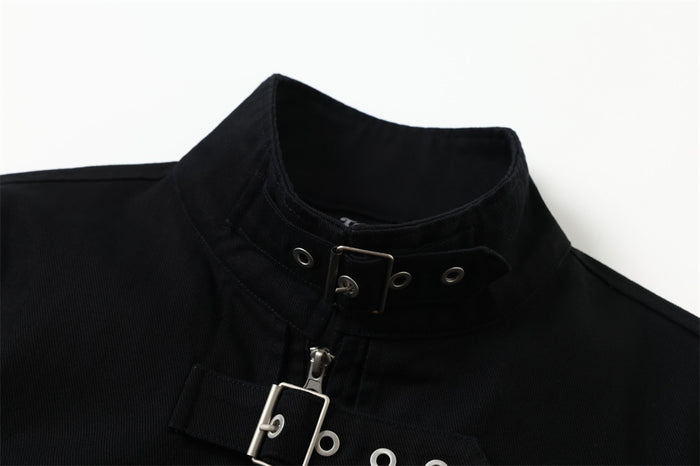Close-up of the black bomber jacket collar with a buckle strap, metal eyelets, and partial front zipper