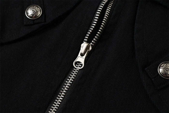 Close-up of the black jacket front zipper with silver pull and decorative metal buttons on nearby pocket flaps