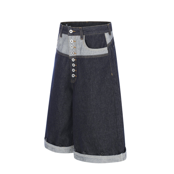 Wide-leg denim shorts with contrast patchwork front, button fly, and rolled cuffs