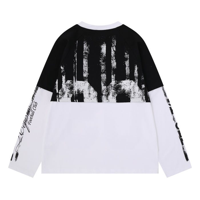 Black and white colorblock tee back with distressed upper-panel graphics and black script and lettering on the white sleeves