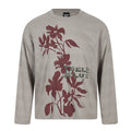 Front view of a taupe oversized long sleeve tee with burgundy floral graphics and green lettering