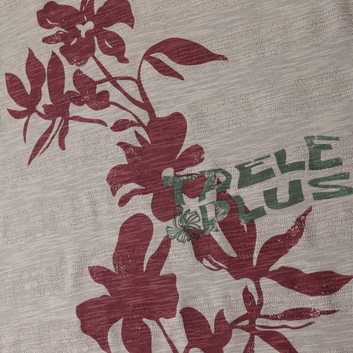 Close-up of burgundy floral artwork and overlapping green lettering on the taupe tee