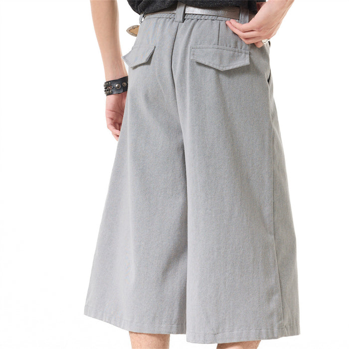 Light gray wide-leg cropped shorts, back view worn by model with flap pockets and belt