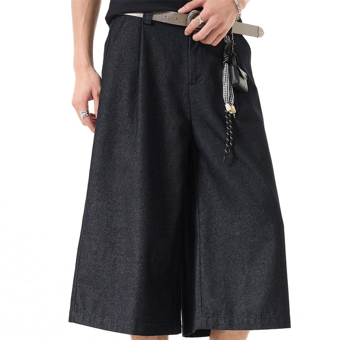 Dark navy wide-leg cropped shorts worn by model, front view with hanging belt strap