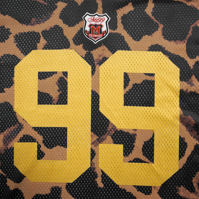 Close-up of the leopard print jersey front featuring a large yellow number 99 and small crest below the neckline