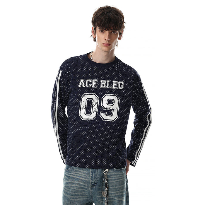 Angled view of a navy dotted long-sleeve tee with striped sleeves, ACE BLEG lettering, and large number 09