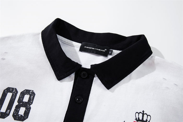 Close-up of black collar and button placket on white polo shirt