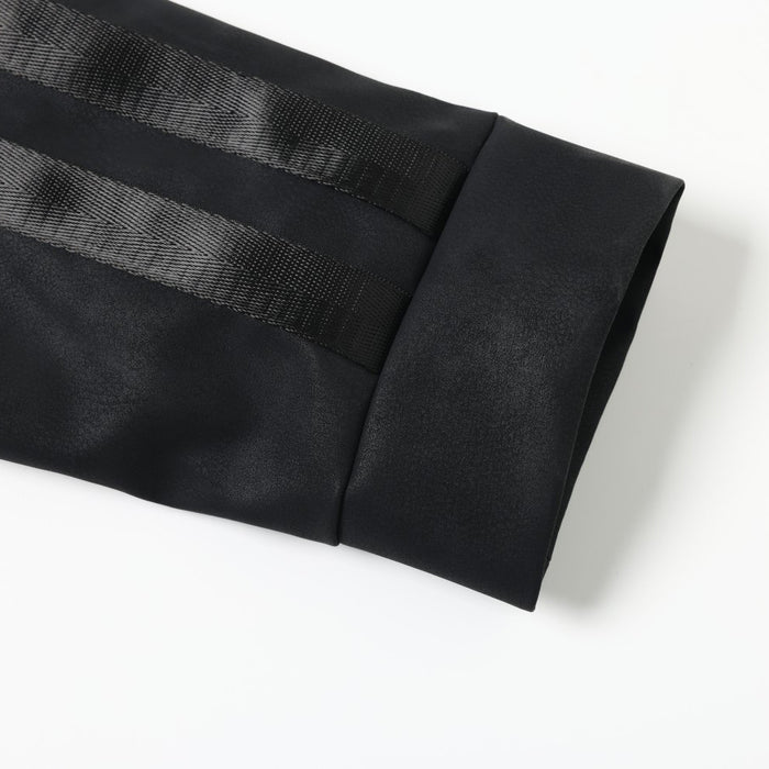 Black jacket sleeve cuff with smooth faux leather and tape trim