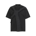 Black oversized men's tee with frayed cross patchwork and washed cotton texture on a white background