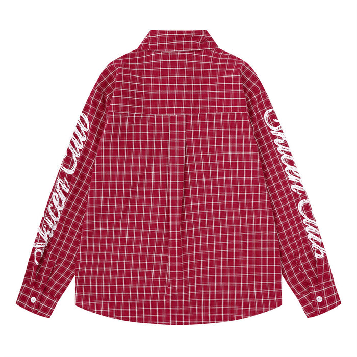 Back view of a red plaid long-sleeve shirt with white script lettering along both sleeves