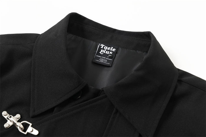 Black asymmetric jacket collar and diagonal front clasp close-up