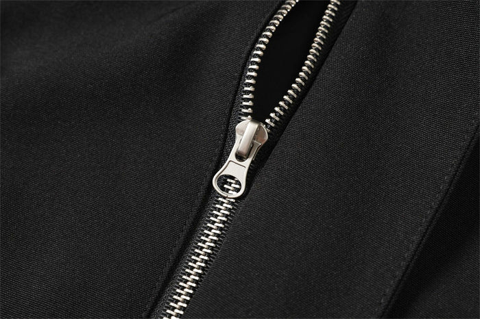 Black zipper detail on the front diagonal placket