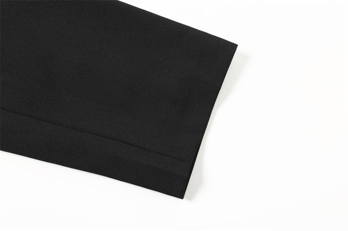 Black jacket cuff with straight hem and clean stitching