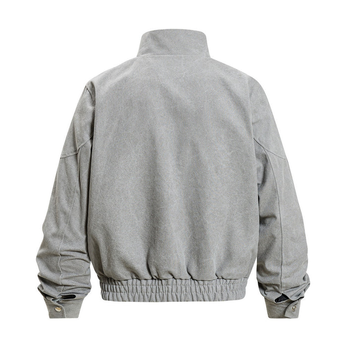 Light gray bomber jacket shown from the back with a raised collar, sculptural sleeve seams, and elastic hem