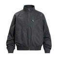 Black stand-collar bomber jacket front view with sculptural curved seams, zippered chest pocket, and ribbed hem