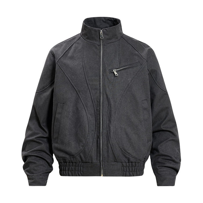 Black stand-collar bomber jacket front view with sculptural curved seams, zippered chest pocket, and ribbed hem