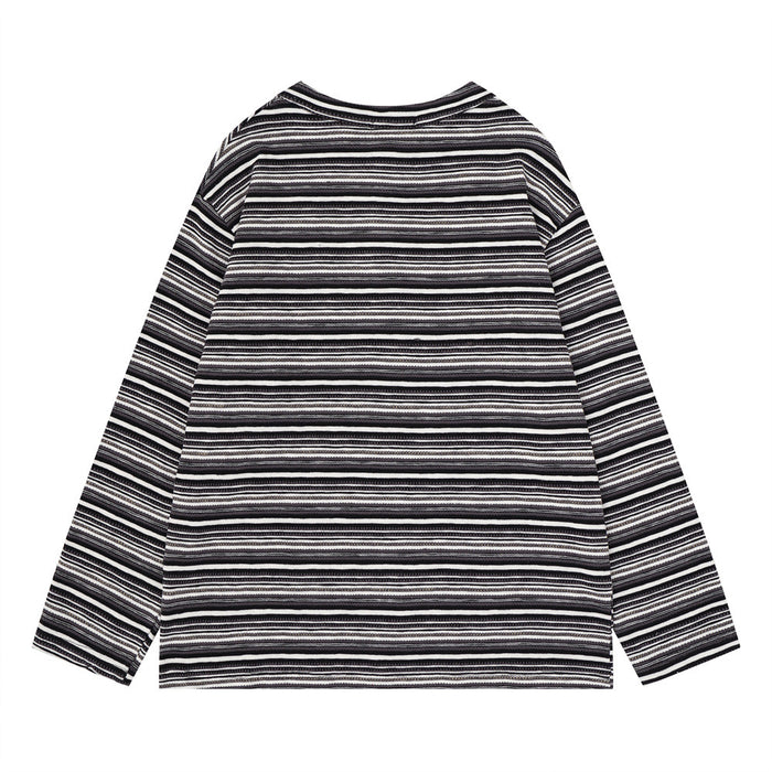 Back view of a black and white striped long-sleeve knit henley shirt