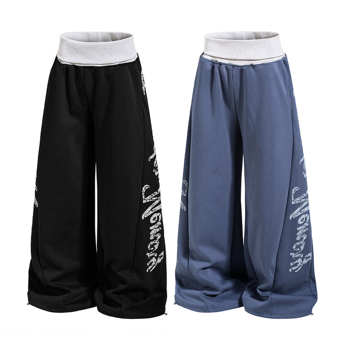 Black and slate blue wide-leg sweatpants with white ribbed waistbands and white side letter prints