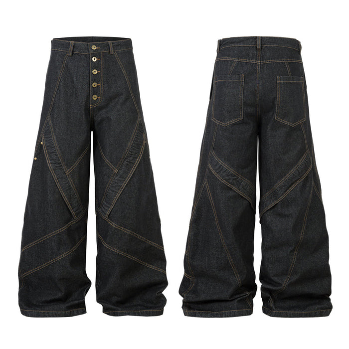 Front and back view of dark wide-leg denim pants with geometric multi-panel seams and gold contrast stitching