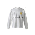 White long-sleeve mesh football jersey with embroidered crest badges and Nautidea Street script logo on the front