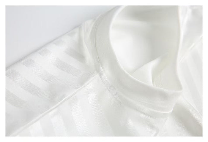 White jersey collar and shoulder seam close-up on mesh fabric
