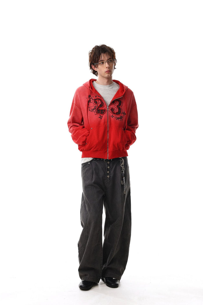 Full-length model wearing the red washed number 23 zip-up hoodie with hands in pockets