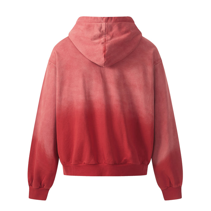 Back view of the red washed zip-up hoodie showing its plain hood and gradient finish