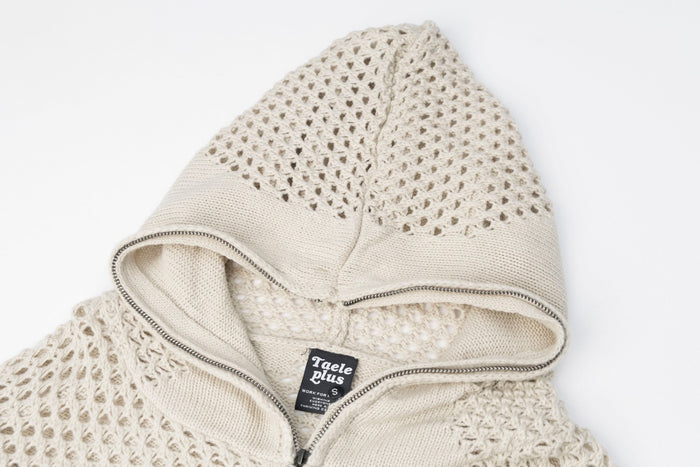 Close-up of the cream hoodie’s perforated knit hood, inner lining, and front zipper