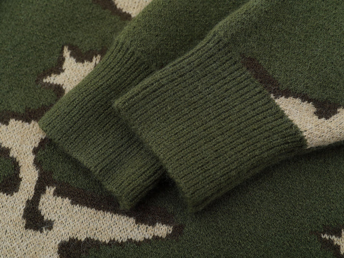 Close-up of ribbed green knit sleeve and cuff on camouflage sweater
