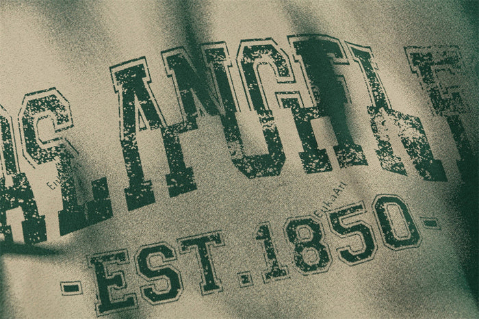 Close-up of distressed Los Angeles EST.1850 lettering printed across the hoodie fabric