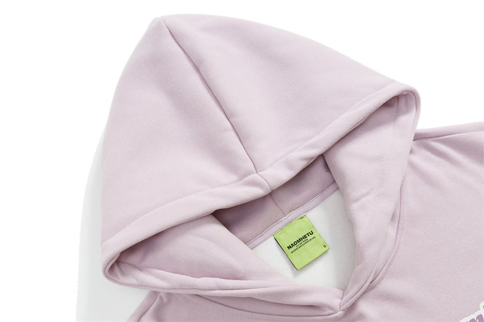 Close-up of the lilac hoodie hood and inner neck label showing the layered hood construction