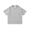 Light gray oversized T-shirt with studded shoulder details, front view