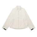 Men's oversized cream stand-collar zip-up jacket with zip pockets and contrast black cuffs, front view
