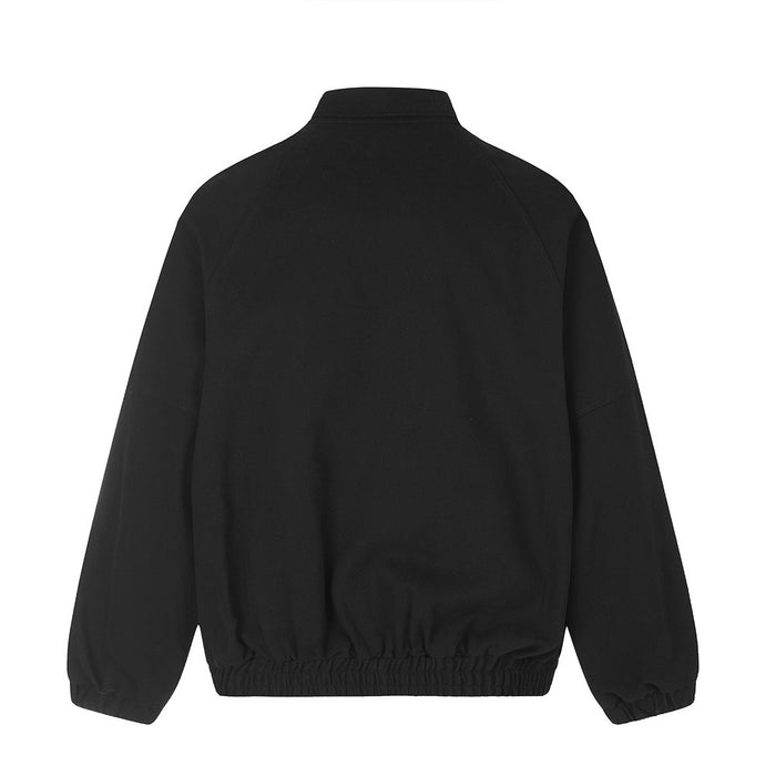 Black oversized bomber jacket back view with elastic hem and long sleeves
