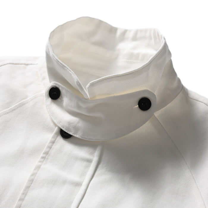 Close-up of white bomber jacket stand collar with black buttons