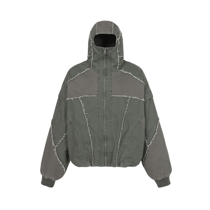 Oversized patchwork hooded bomber jacket with frayed seams in washed grey canvas, front view
