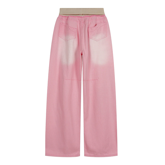 Back view of pink washed wide-leg jeans with beige ribbed waistband and rear patch pockets
