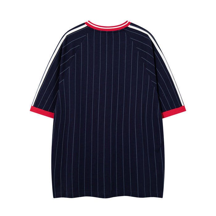 Back view of navy pinstripe oversized jersey tee with red ribbed collar and cuffs
