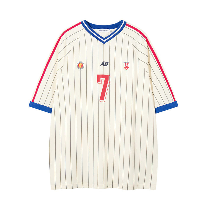 Cream pinstripe soccer jersey tee with blue V-neck, red shoulder stripes, and front number 7