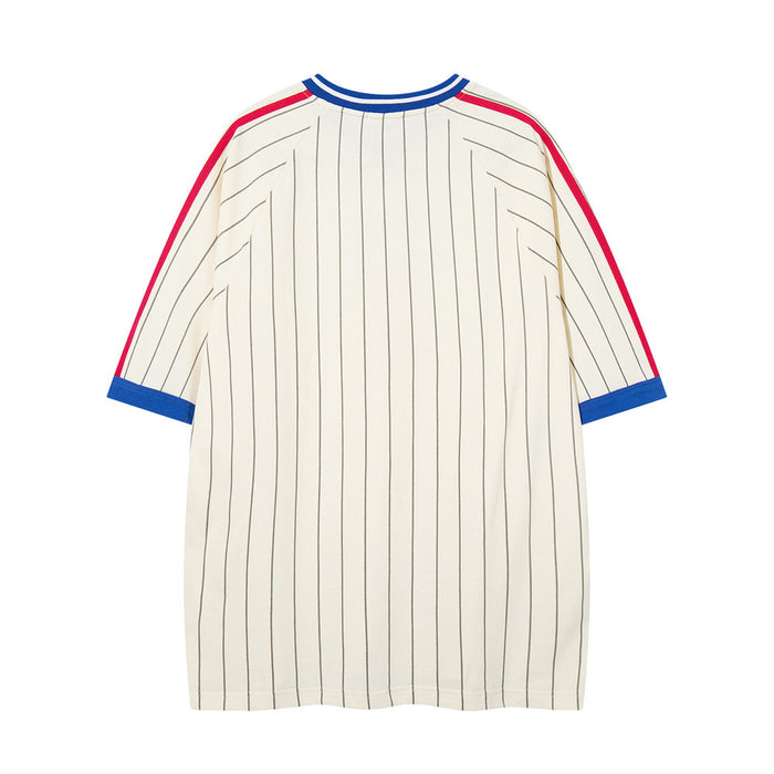 Back view of cream pinstripe oversized jersey tee with blue ribbed collar and red-trimmed sleeves