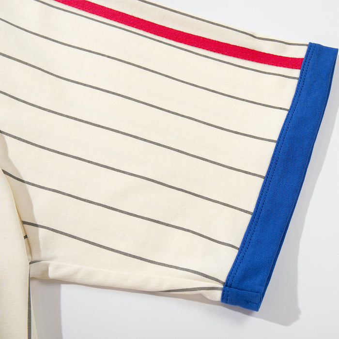 Close-up of cream pinstripe sleeve with red stripe and blue cuff trim