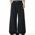 Men's black pinstripe wide-leg double-pleat trousers with floor-length drape, front and back view